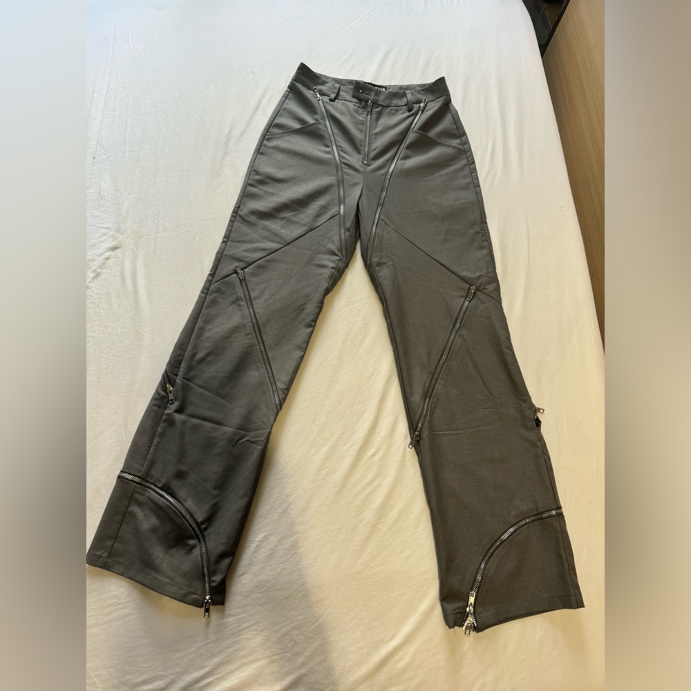 Grey trousers with zip details
Fits the body amazingly 
Never worn
